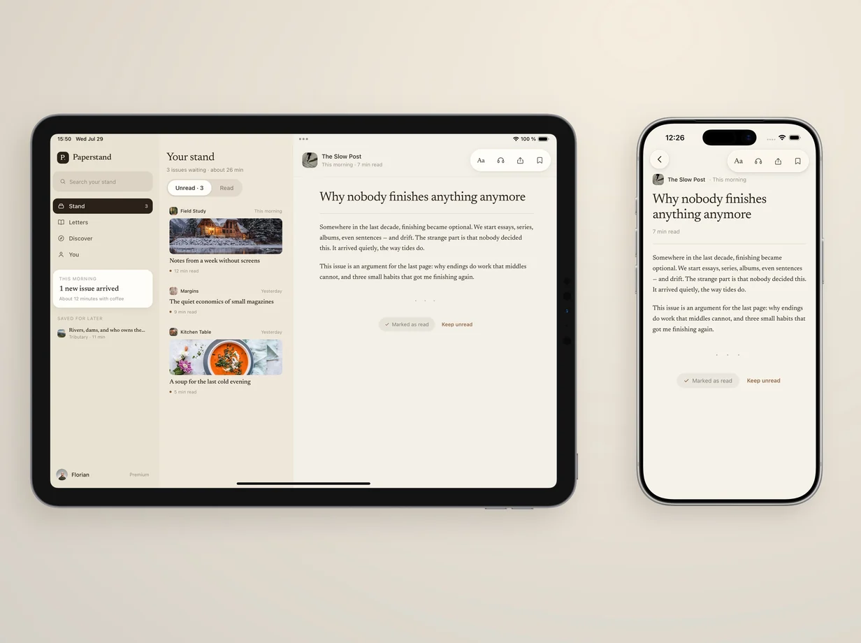 A tablet and a phone on a warm surface, an issue open on both